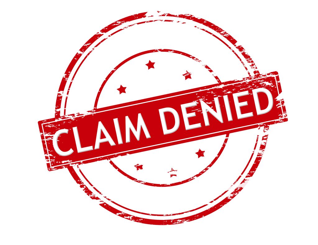 photo of rubber stamp showing long term disability claim denied